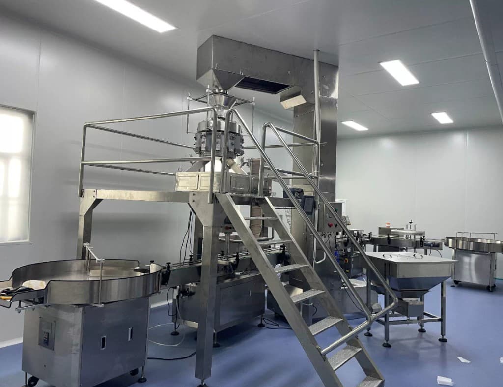 Multi-head weighing and filling line