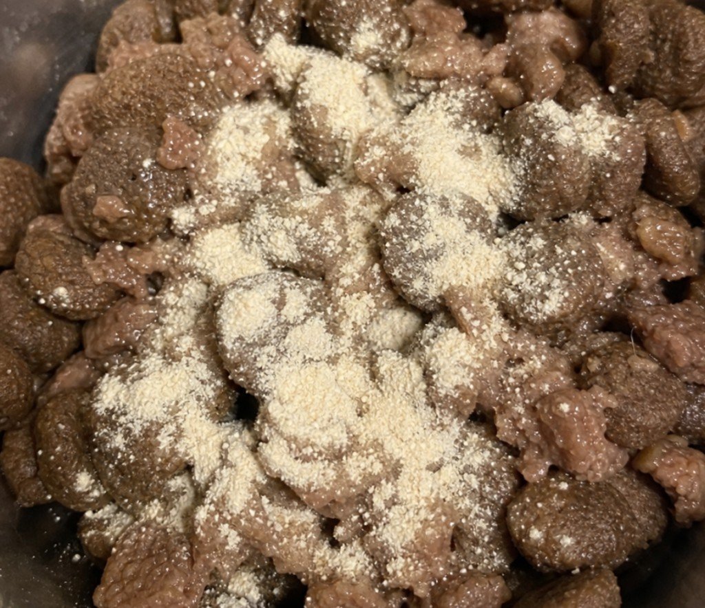 digestive supplement powder sprinkled over wet dog food as a GI support mix-in